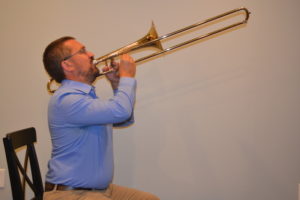 trombone with exaggerated posture