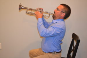 Trumpet with exaggerated posture