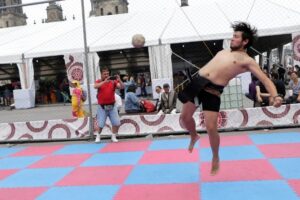 A player leaping into the air during a Mayan ball game.