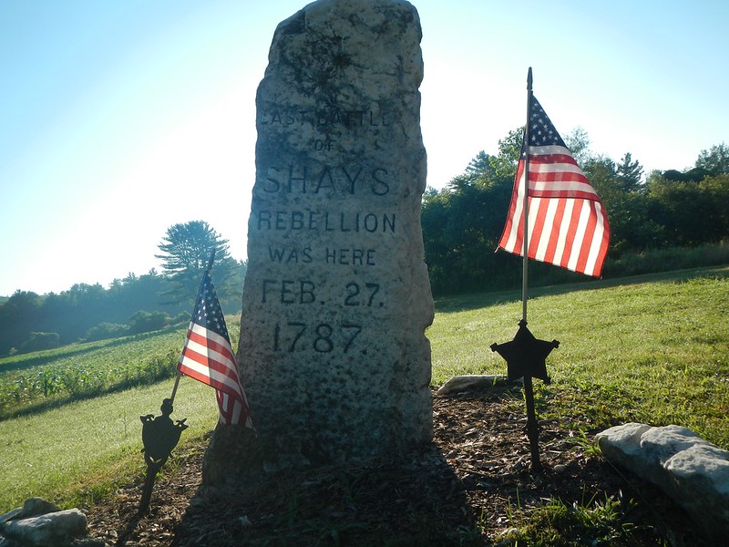 Shays Rebellion monument, sized and shaped roughly like a gravestone in a field.