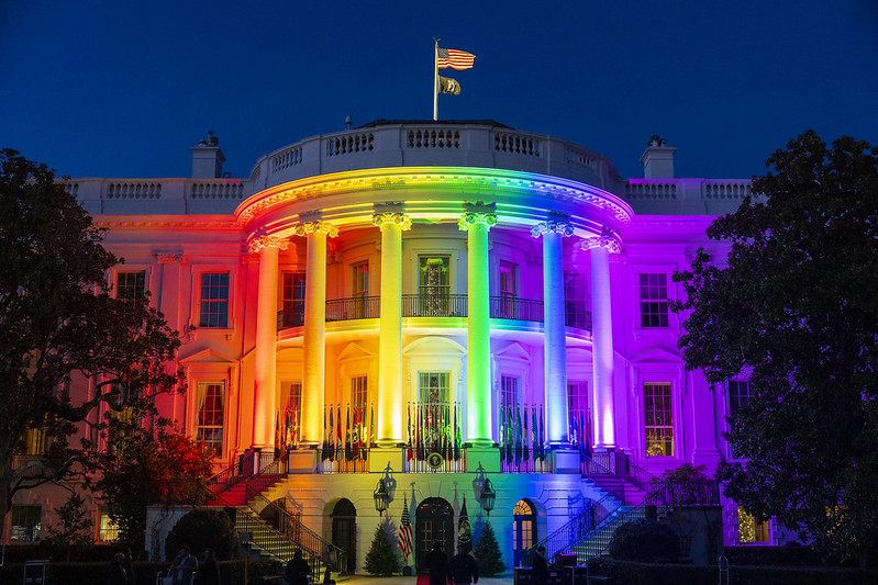 White House illuminated in rainbow colors.