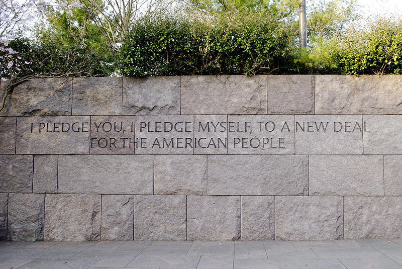 Stone wall engraved with the quote "I pledge you, I pledge myself, to a New Deal for the American People".