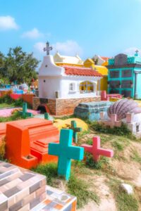 Photo of colorful graves in cemetery