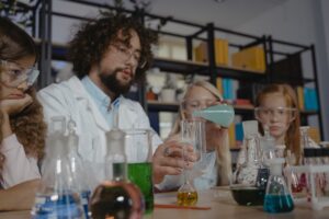 Students using beakers in a chemistry class