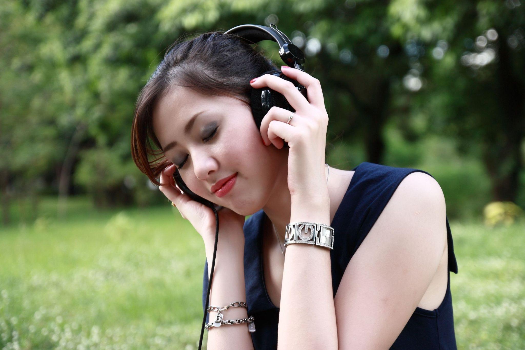 Photo of girl listening to music with her headphones