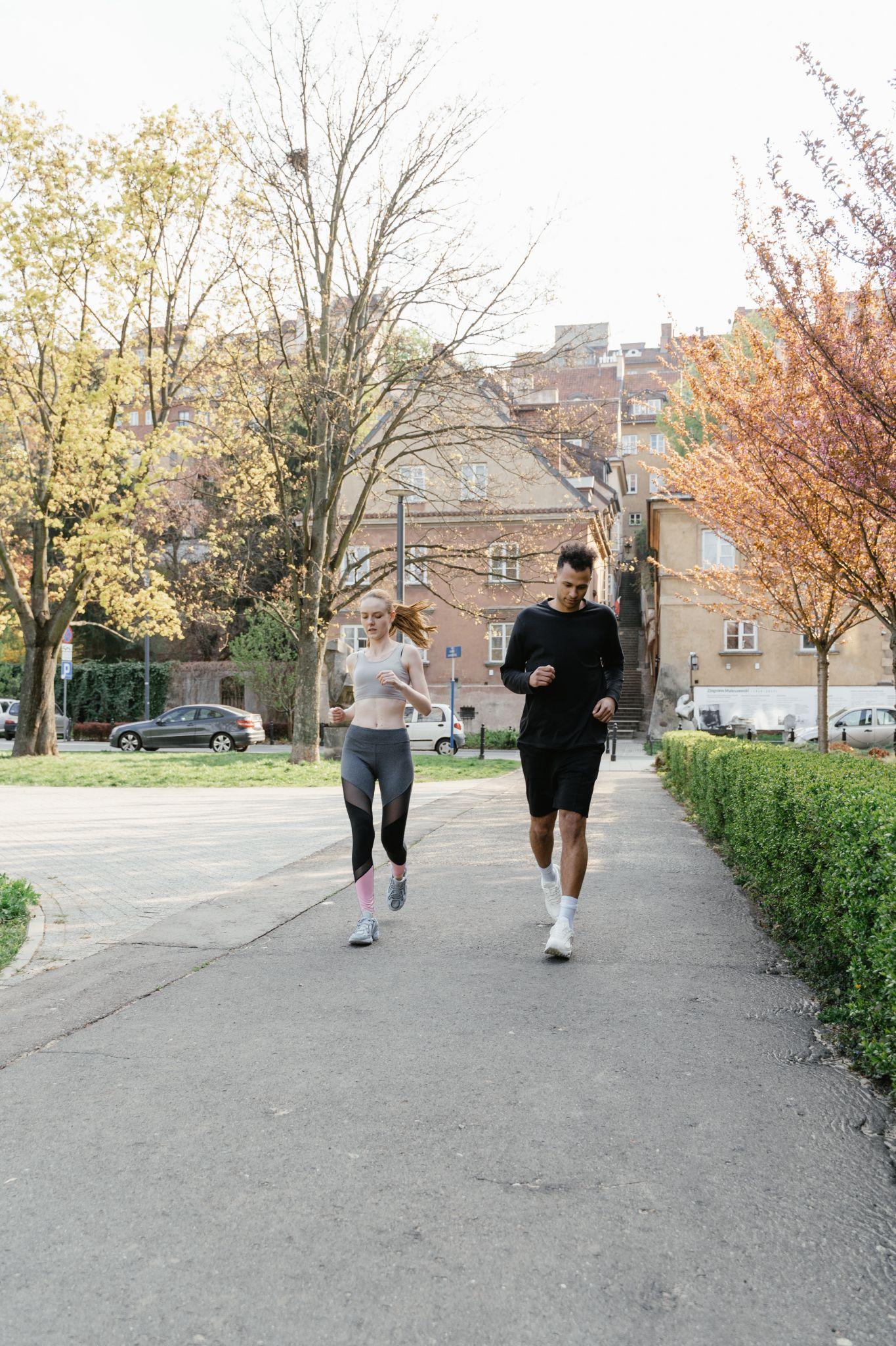 Photo of women and men running together
