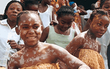 Bubi children with white paint decorating their skin