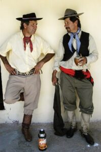 Gauchos leaning against a wall
