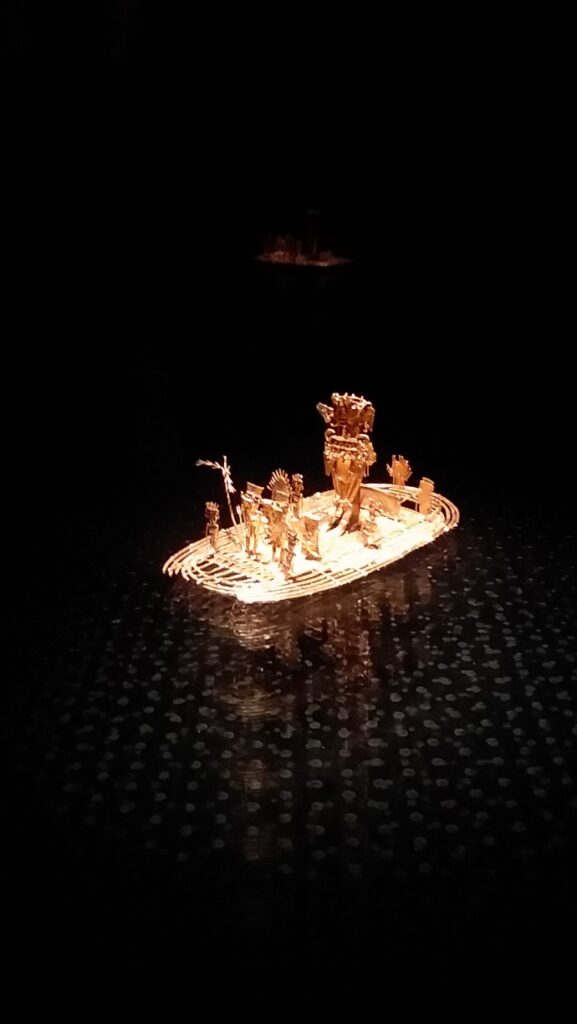 A tiny scene with human figures made of balsa wood