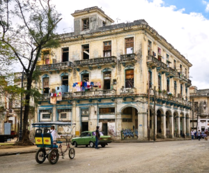 A building with balconies on a Cuban street corner