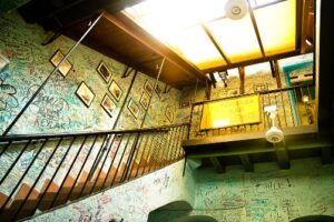 Graffiti on the walls inside building near the stairs