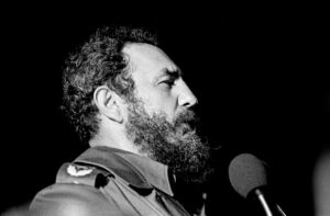 A black and white photo of Fidel Castro in profile