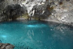 A blue lake inside a cave