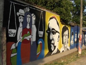 A mural containing portraits of Oscar Romero and others