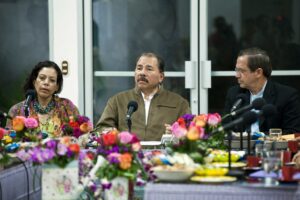 Nicaraguan president Daniel Ortega at a table
