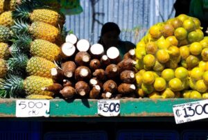 Pineapple, yuca, and oranges for sale