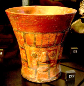 Ceramic vase with a face in the side
