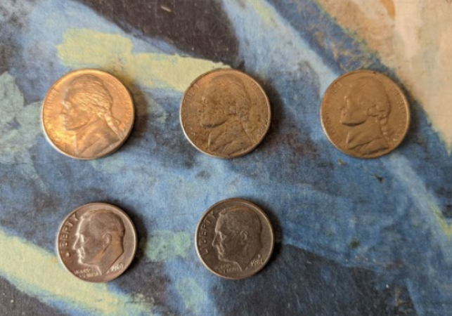 photograph of three nickels and two dimes