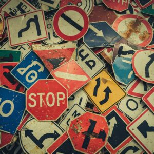 A jumbled pile of traffic signs.