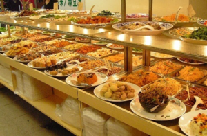 A buffet line of food