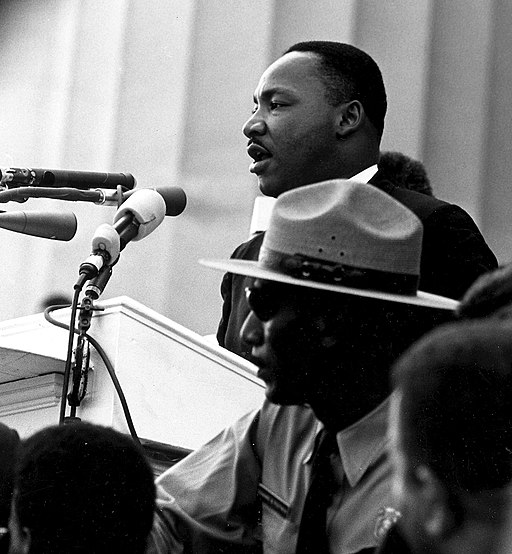 martin Luther king dr speaking into a microphone