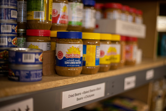 A shelf with jars of food on it