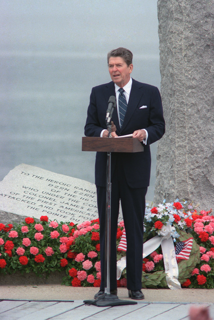 Ronald Reagan speaking at a podium outdoors