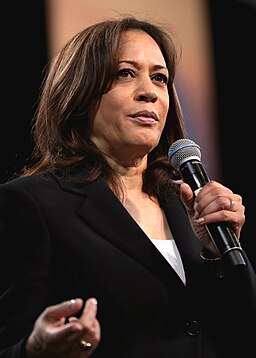 Kamala Harris holding a microphone