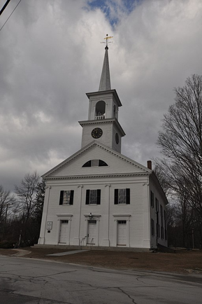 Picture of a large white building with a steeple