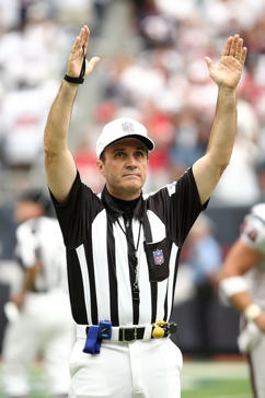 Referee with hands up