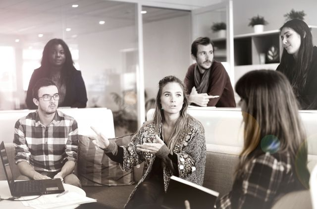 A group of men and women talking