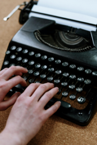 Hands on a old-style typewriter