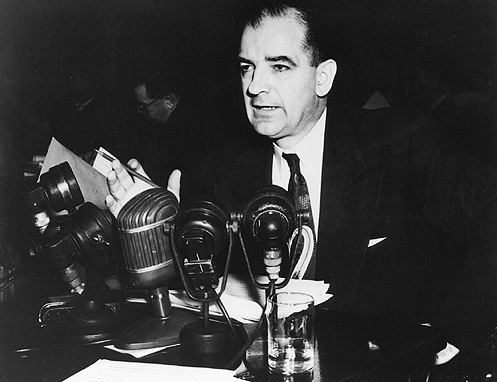 Senator McCarthy speaks into microphones