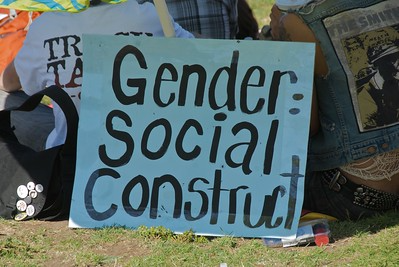 A protest sign that reads, "Gender: Social Construct"