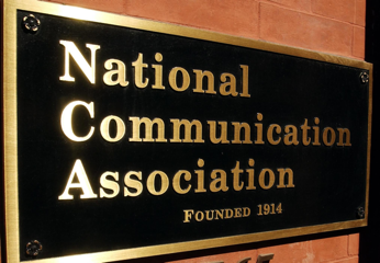 black and gold sign that reads National communication association, founded 1916