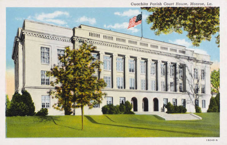 Postcard looking West down Main Street in Walnut Ridge at the Ouachita Parish Court House, a white stately building.