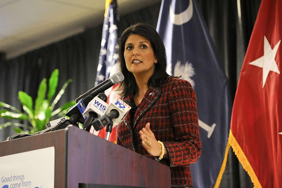 Nikki Haley speaks at a podium indoors.